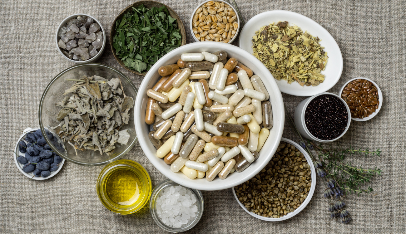 A diverse collection of herbs and spices, showcasing natural supplements aimed at enhancing energy and alleviating stress.