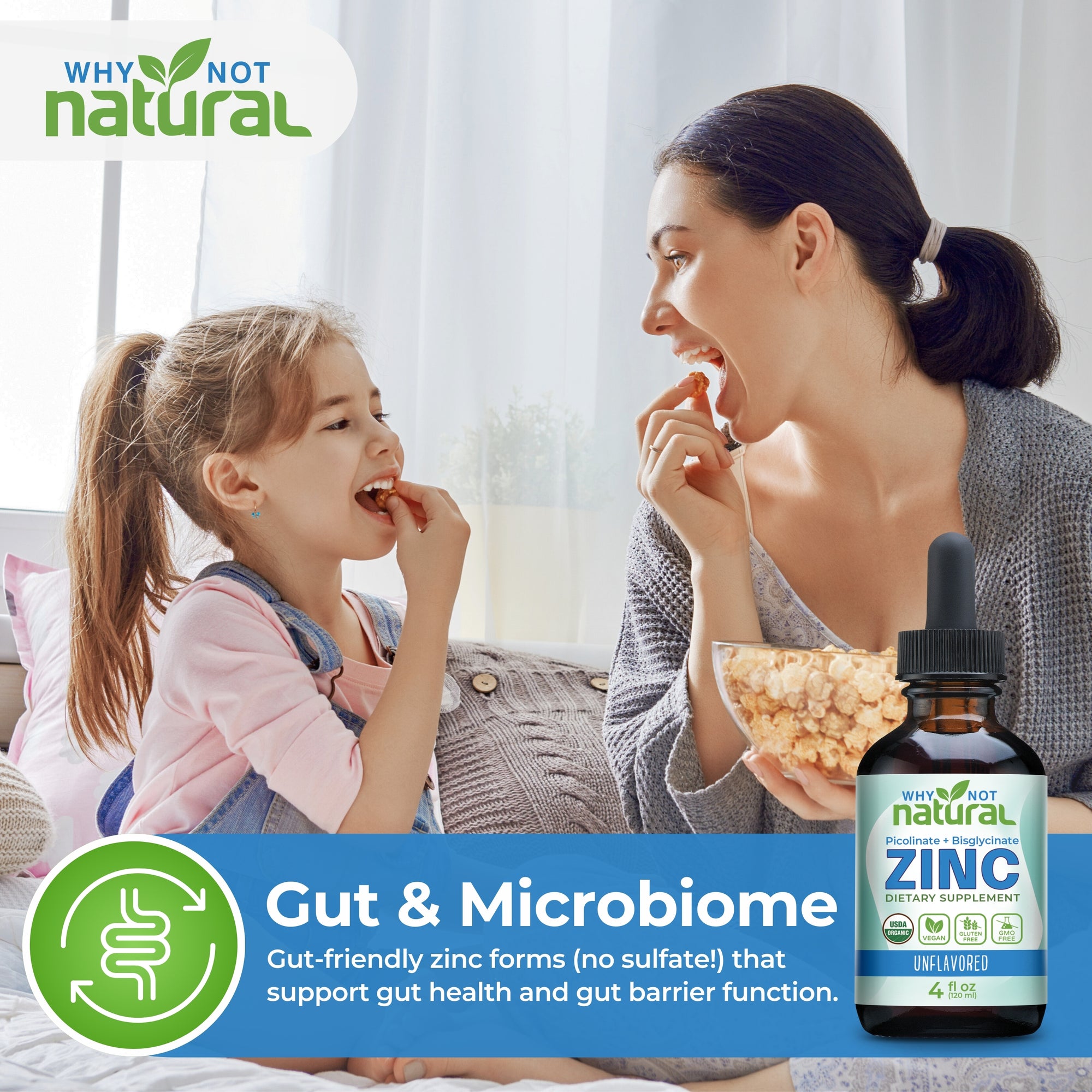 Woman and child with a bottle of Zinc supplement on a couch, promoting gut and microbiome health.