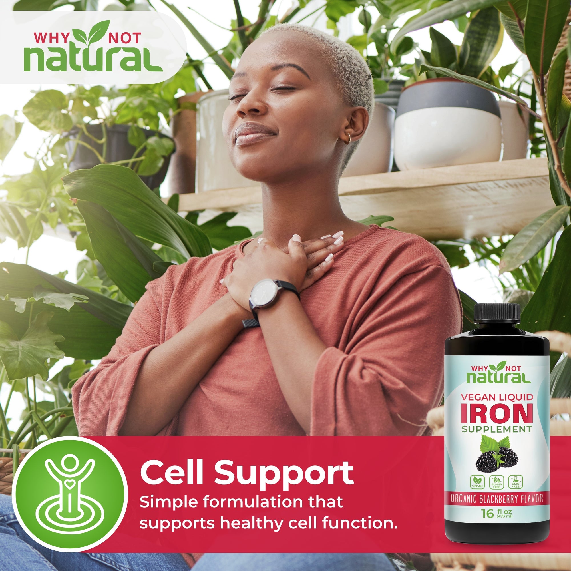 Woman with a bottle of Vegan Liquid Iron supplement in a natural setting