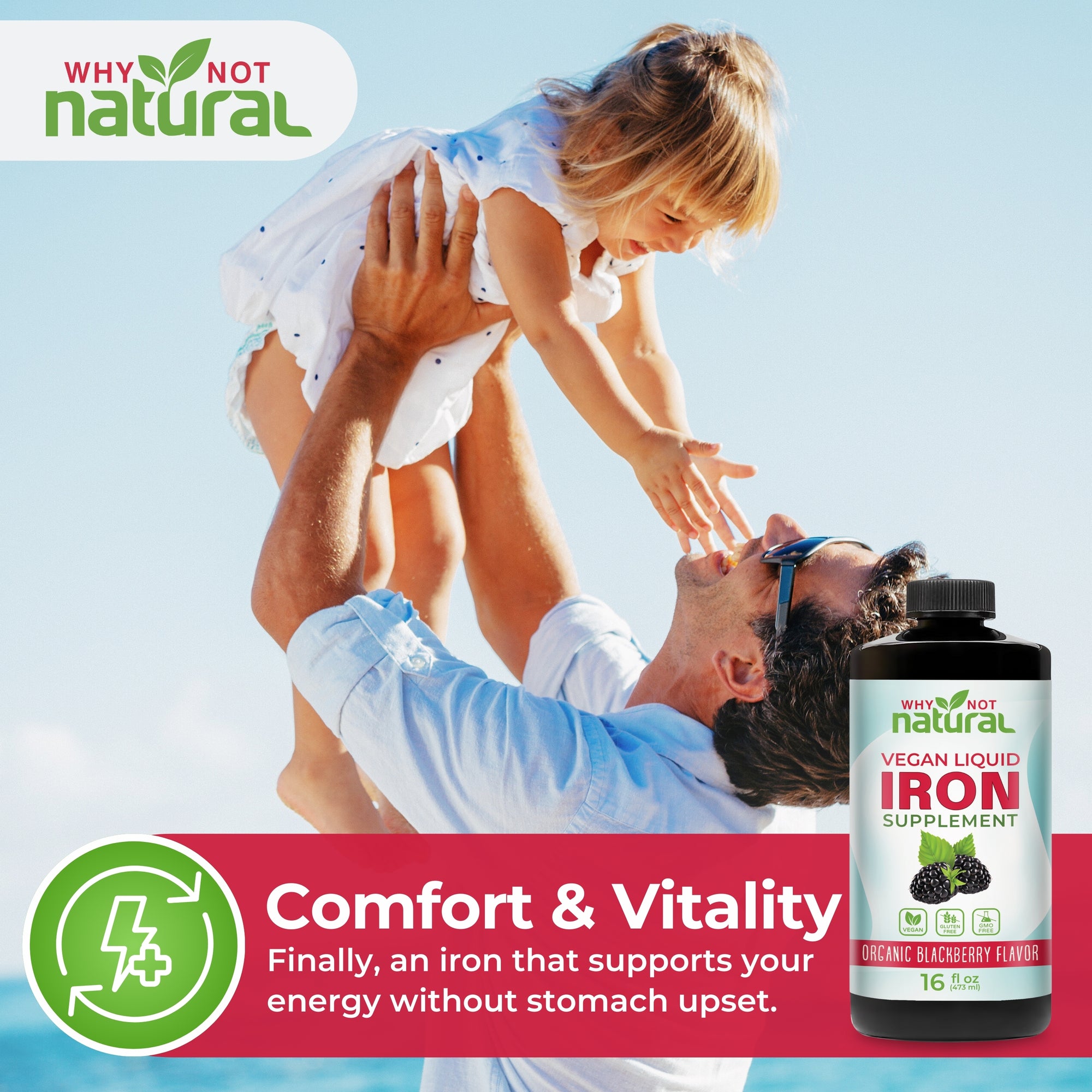 Man lifting a child with 'Why Not Natural' iron supplement bottle on a blue sky background
